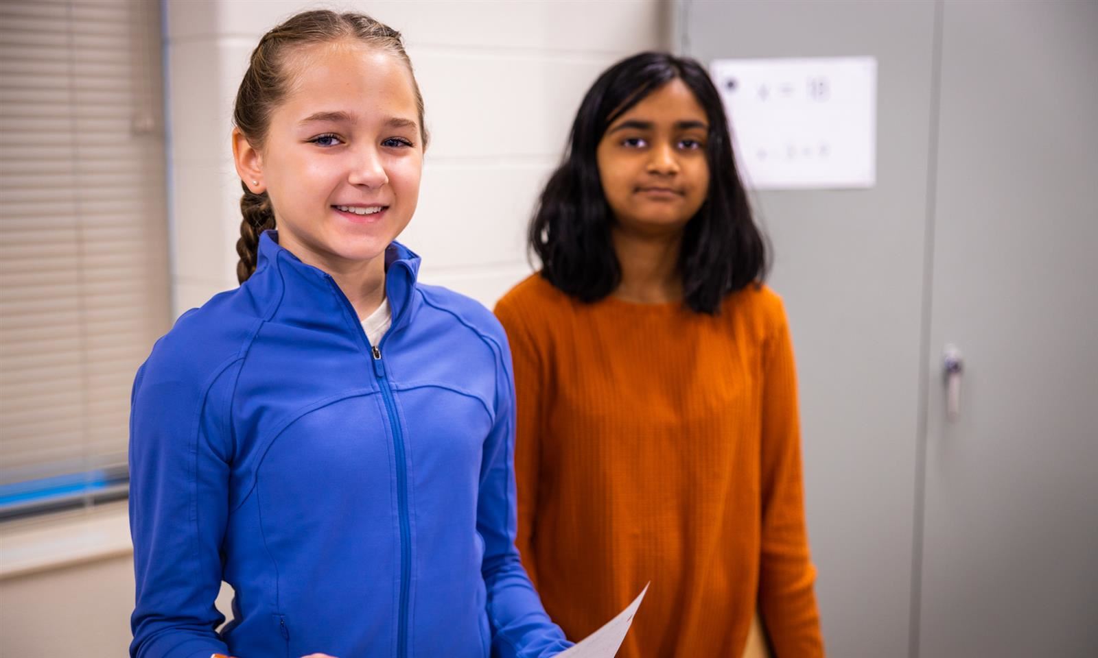 Two girls smile